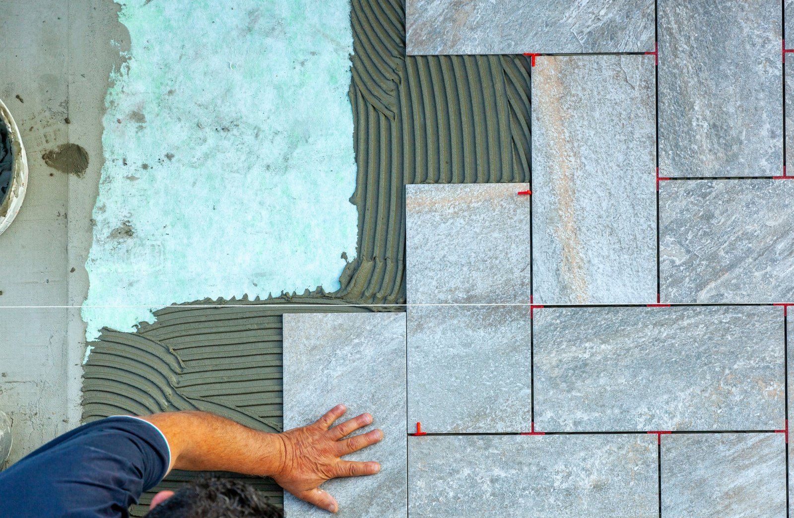 top view of a tiler working in a garden